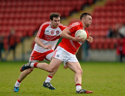 TOP FLIGHT...Benny Heron chases down Paul Kerrigan in Derry's last game in division 1, a defeat at home to Cork in 2015
